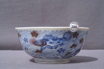 A Chinese blue and underglaze red bowl with carps and marine animals, Xuande mark, Kangxi